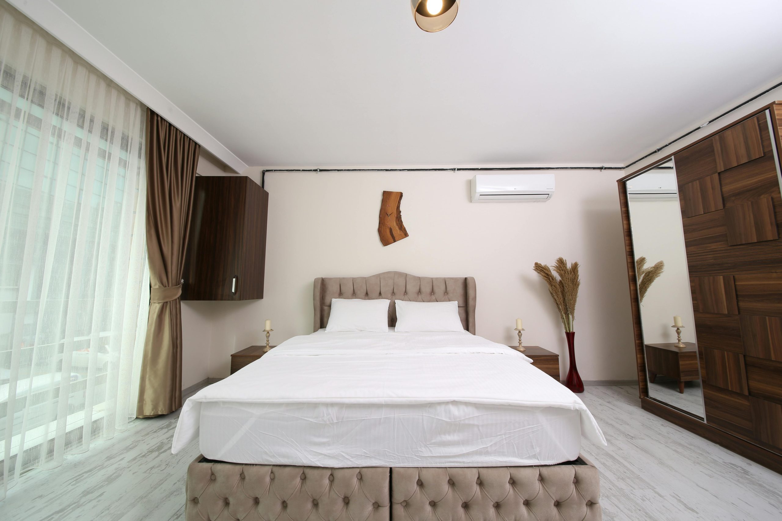Contemporary bedroom with elegant furniture and decor in an Istanbul hotel room.